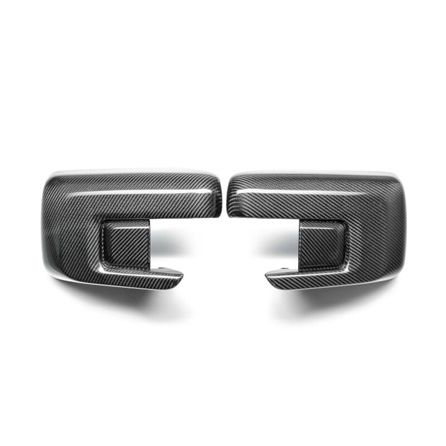 Anderson Composites carbon fiber mirror caps for Ford F-150 2021-2025, showcasing sleek, textured carbon fiber surface on vehicle mirrors.