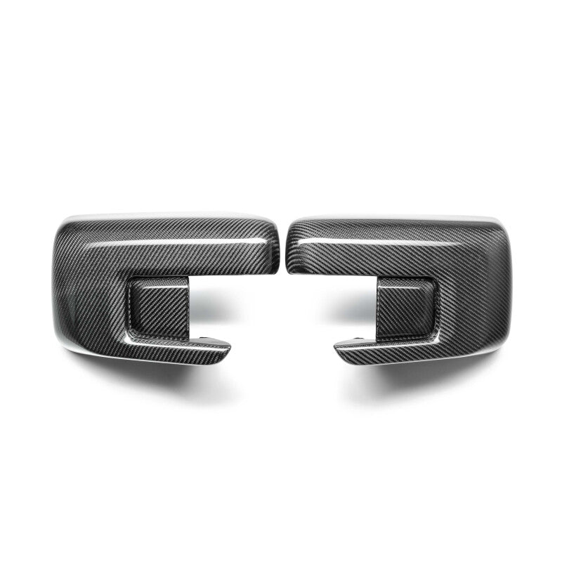 Anderson Composites carbon fiber mirror caps for Ford F-150 2021-2025, showcasing sleek, textured carbon fiber surface on vehicle mirrors.