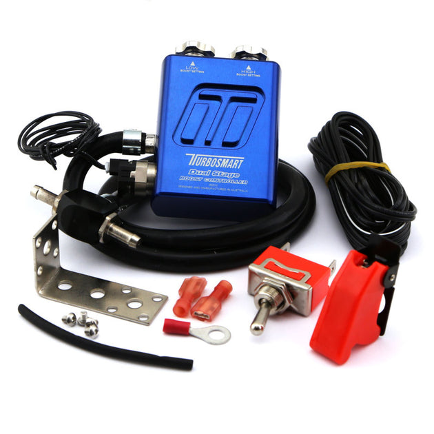 Turbosmart Dual Stage Boost Controller V2 in blue, a compact device with control knobs and display for turbo boost management.