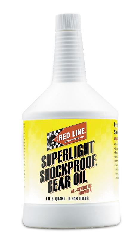 Red Line SuperLight ShockProof Gear Oil quart bottle, orange and black packaging, with product label visible.