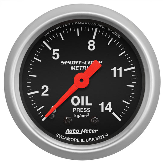 AutoMeter Sport Comp 52.4 mm mechanical oil pressure gauge showing 0-14 Kg/cm² with black dial and white markings.