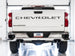 AWE Tuning 4th Gen GM 1500 6.2L catback exhaust with split rear exit and quad chrome tips, showing the polished chrome finish and bumper cutouts.