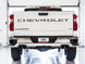 AWE Tuning 4th Gen GM 1500 6.2L catback exhaust with split rear exit and quad chrome tips, showing the polished chrome finish and bumper cutouts.