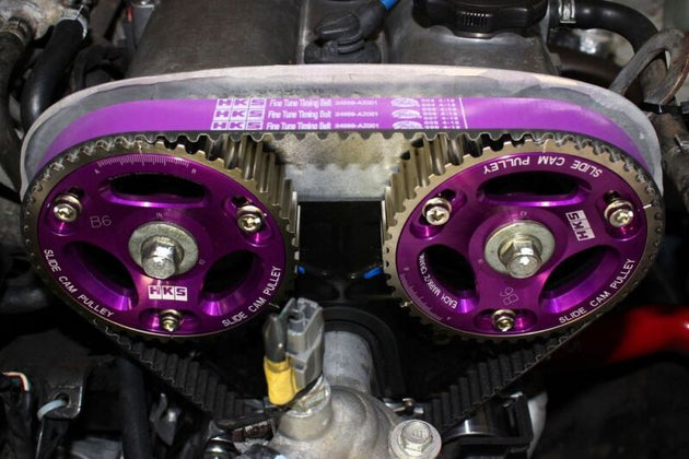HKS slide cam pulley for B6/BP engines, high-performance cam gears with adjustable design and durable metal construction.