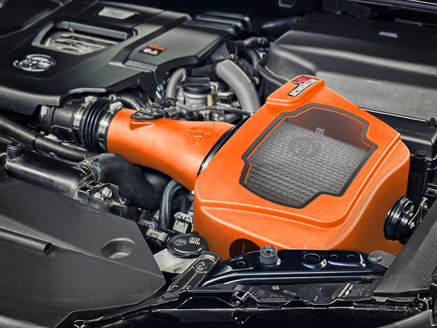 aFe Momentum Sealed Cold Air Intake for Toyota Land Cruiser J300 22-25 V6 3.3L engine, showing the intake tube and filter.