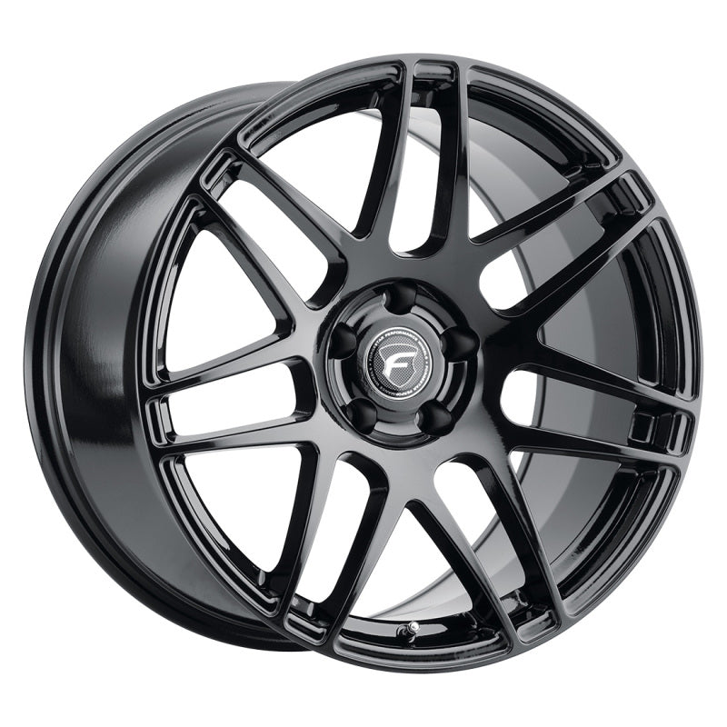 Forgestar F14 19x10 cast wheel in gloss black with 5x120.65 bolt pattern and ET30 offset, shown from a side angle.
