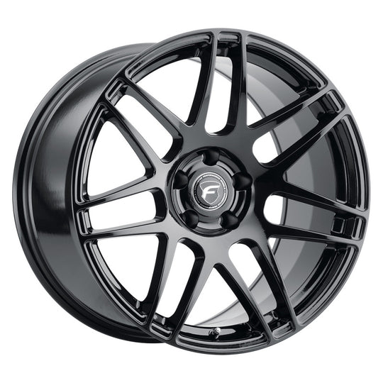 Forgestar F14 19x10 cast wheel in gloss black with 5x120.65 bolt pattern and ET30 offset, shown from a side angle.