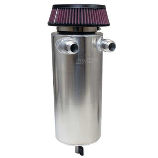 Moroso 6-inch diameter aluminum oil catch can with dual -16AN inlet for vehicle crankcase ventilation system.