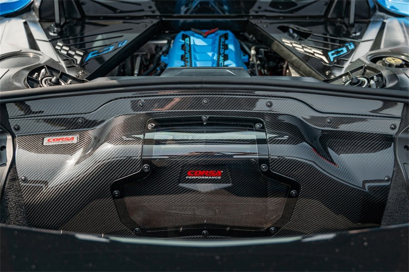 Corvette C8/Z06 carbon fiber air intake trunk panel with polycarbonate from CORSA Performance, showcasing sleek, lightweight automotive accessory.