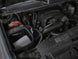 aFe Magnum FORCE Stage-2 Pro Dry S cold air intake system installed in a 2009-2014 Chevrolet Silverado or GMC Yukon.