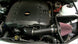 K&N Engineering cold air intake for Chevy Camaro 3.6L V6 engine, showing the black intake tube and air filter component.