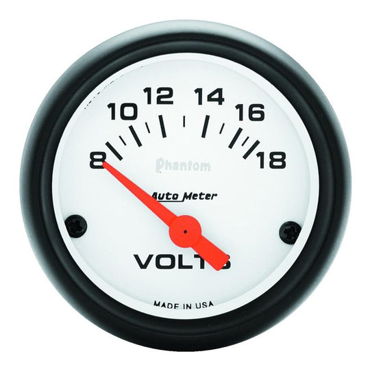AutoMeter Phantom 52mm electronic voltmeter gauge displaying voltage levels from 8 to 18 volts in a vehicle dashboard.
