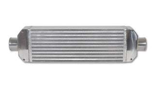 Vibrant air-to-air intercooler with end tanks, measuring 18x6.5x3.25 inches, featuring inlet and outlet ports.