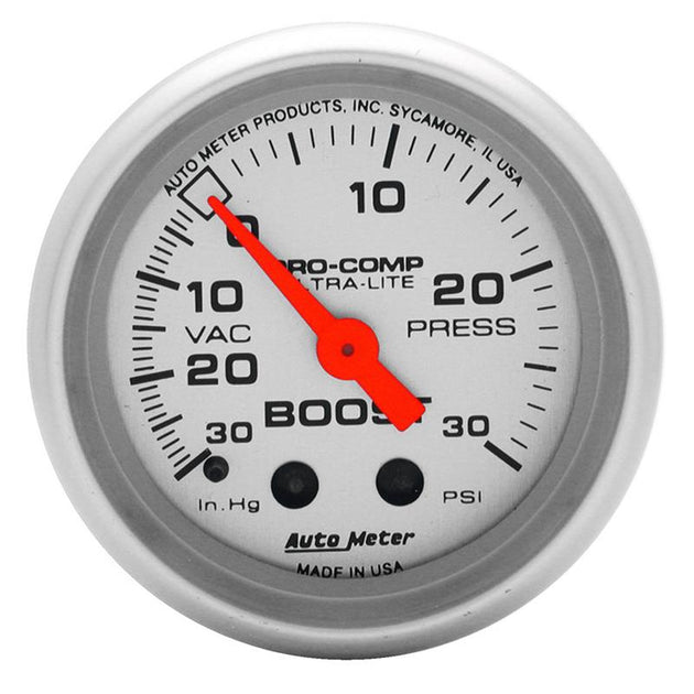 AutoMeter Ultra-Lite 52mm 30 PSI mechanical boost gauge showing black dial with white markings and needle for car engine boost monitoring.