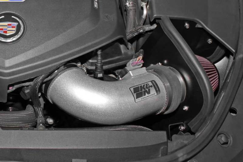 K&N Engineering cold air intake for 2009-2015 Cadillac STS-V 6.2L V8 engine, featuring the Typhoon performance design.