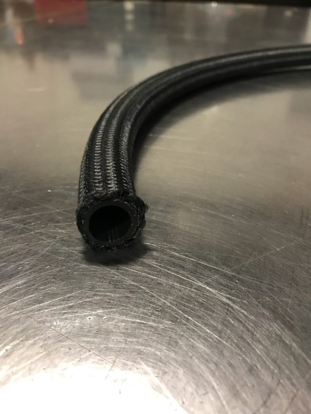 Fragola -12AN premium nylon race hose, 6 feet long, with black and red flexible hose shown on a white background.