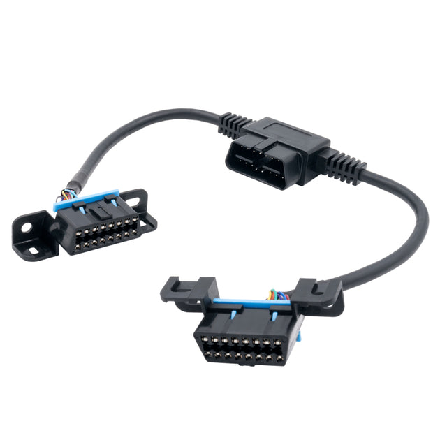 AutoMeter OBD-II signal splitter and adapter for gauges, shown with connected cables and ports on a white background.