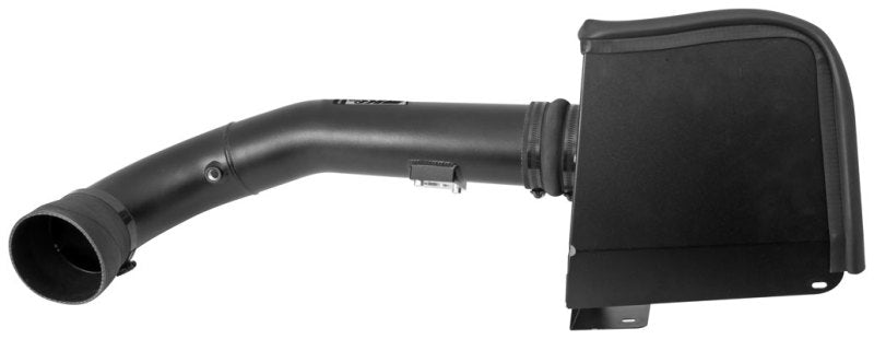 K&N black performance cold air intake kit installed in a 2009-2013 Chevy Silverado, Avalanche, Suburban, or GMC Yukon engine bay