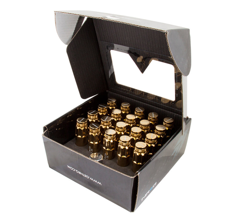 NRG 700 Series M12 x 1.25 steel lug nut set with dust caps, locks, and socket in chrome gold finish, displayed on a white background.