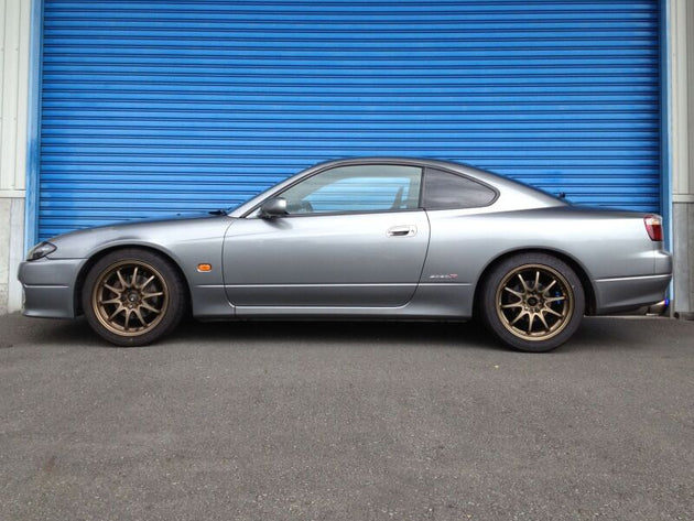 HKS Hipermax S coilover kit for Nissan S14 and S15, showing the adjustable coilover shocks with branding and mounting hardware