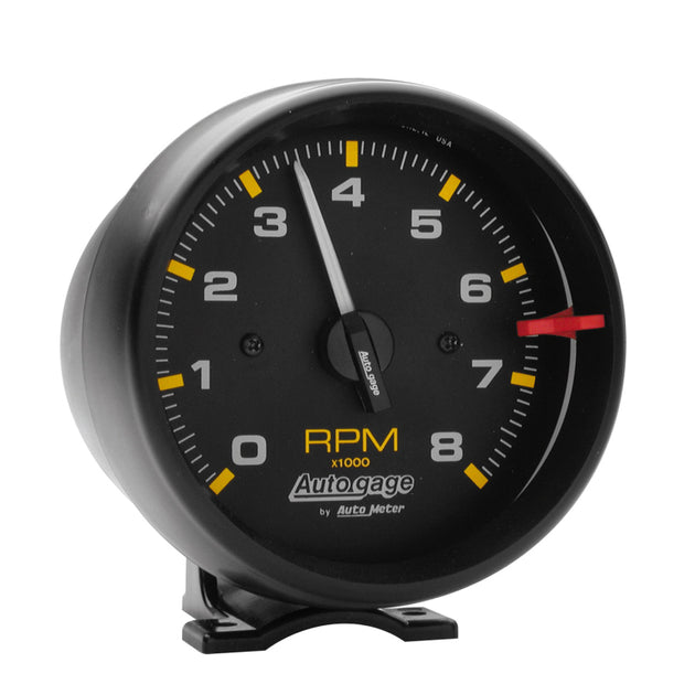 AutoMeter Autogauge black 8,000 RPM pedestal mount tachometer with clear dial and numeric display for vehicle performance monitoring.