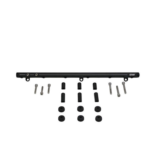 DeatschWerks Nissan RB25DET fuel rail for 89-98 Nissan Skyline, showing the metal rail with mounting points and fuel inlet.