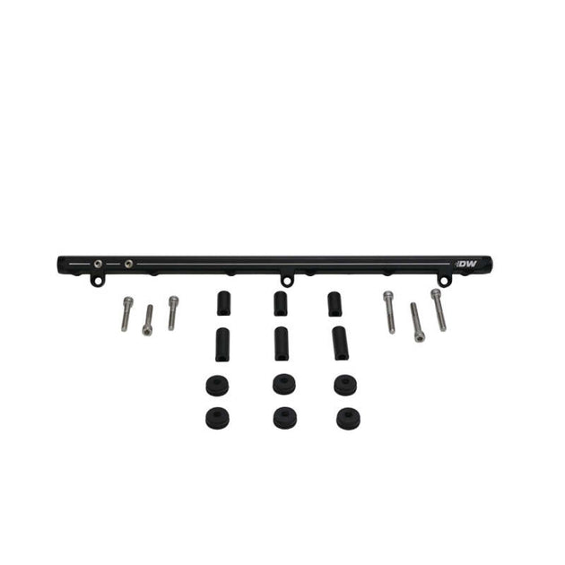 DeatschWerks Nissan RB25DET fuel rail for 89-98 Nissan Skyline, showing the metal rail with mounting points and fuel inlet.