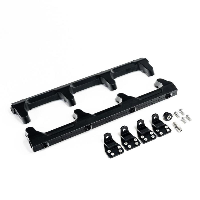 DeatschWerks Chevrolet LSA/LS9 fuel rails installed on engine, showcasing durable metal construction and precise fitting.