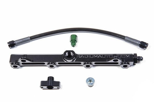Radium Engineering GM LS9/LSA engine fuel rails, black aluminum with mounting brackets, designed for high-performance fuel delivery.