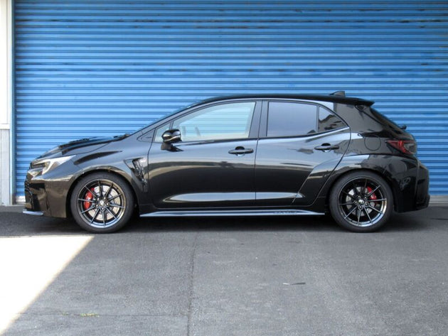 HKS Hipermax MAX S coilover suspension kit installed on a 2023+ Toyota GR Corolla, showing adjustable shock absorbers and coil springs