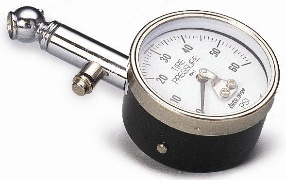 AutoMeter NASCAR Performance tire pressure gauge showing a 40 PSI low-pressure reading on a digital display.
