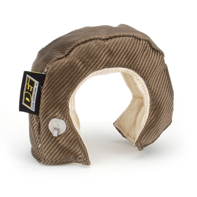 DEI Turbo Shield T3 titanium turbo blanket shield, heat-resistant automotive part, designed for turbocharger protection and performance.