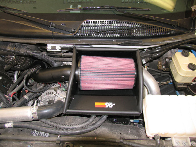 K&N Engineering cold air intake kit installed on a 2006 Chevrolet/GMC TopKick V8-6.6 diesel engine, showing the air filter and intake tubing.