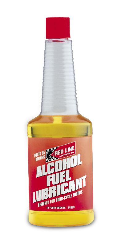 Red Line 4-Cycle Alcohol Fuel Lubricant additive in 12oz bottle with red label designed for engine performance.