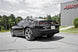 MBRP black coated axle back muffler delete for 2010-2015 Chevrolet Camaro V6 3.6L exhaust system on vehicle.