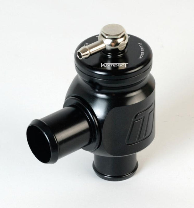 Turbosmart BOV Kompact Plumb Back 34mm blow off valve, silver metal with black accents, mounted on a vehicle engine.