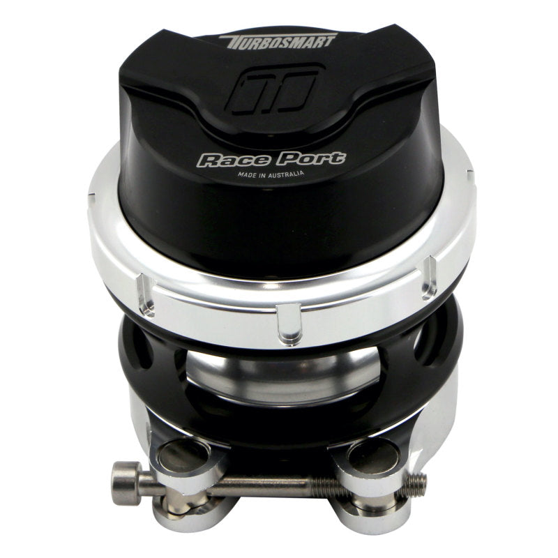 Turbosmart GenV RacePort black blow off valve with female flange for turbocharged engines, showcasing sleek design and connection ports.