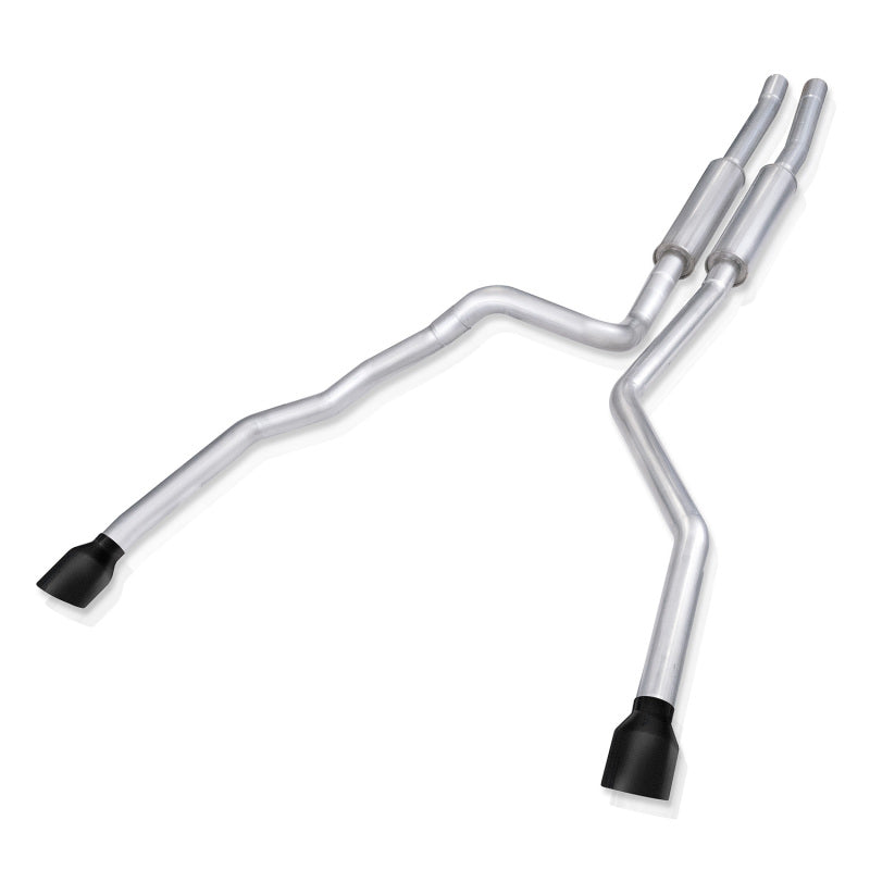 Stainless Works 21-24 Ram TRX 6.2L catback exhaust system with matte black tips, installed on a Ram TRX pickup truck.