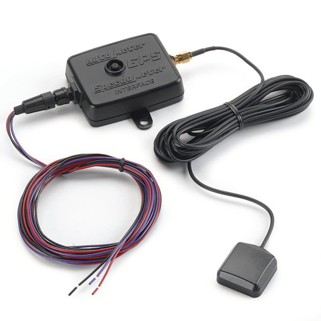 AutoMeter universal GPS speedometer interface module gauge showing connection ports and digital display for vehicle speed data.