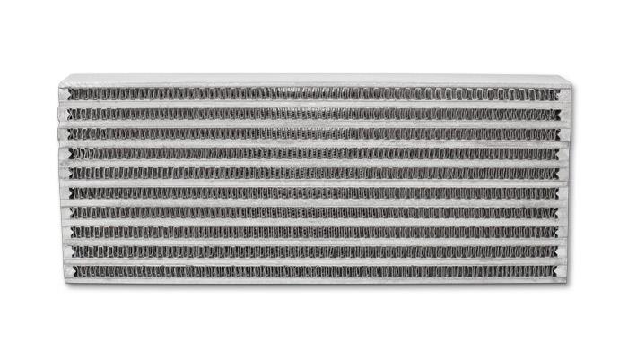 Vibrant universal oil cooler core, 4x10x1.25 inches, showing a vibrant aluminum core with inlet and outlet ports for engine cooling.