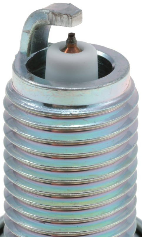 Set of four NGK Iridium IX spark plugs with metal shells and black insulators, designed for vehicle ignition systems.