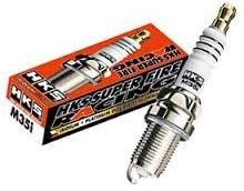 HKS Super Fire Racing M40G spark plugs arranged in a row with metal connectors and ceramic insulators on a white background.