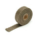 DEI Titanium Exhaust Wrap 1in x 15ft, heat-resistant wrap for exhaust systems, shown in a rolled fabric form.