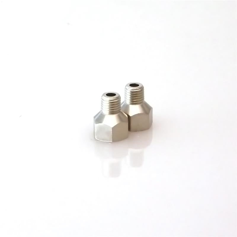Turbosmart 1/16in NPT male fitting connected to 1/8in NPT female fitting for automotive or turbocharger applications.