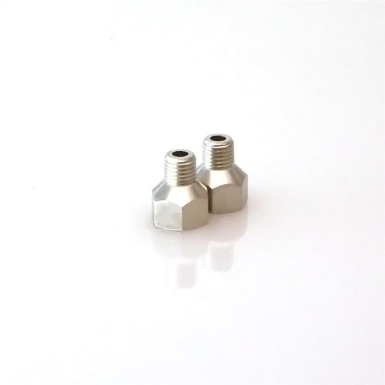 Turbosmart 1/16in NPT male fitting connected to 1/8in NPT female fitting for automotive or turbocharger applications.