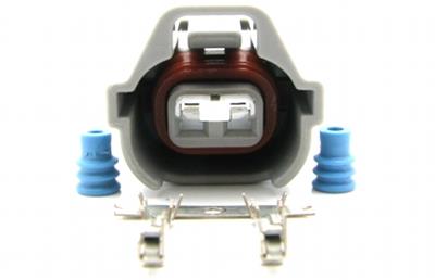 DeatschWerks fuel injector connector housing and pins for Sumitomo electrical re-pinning, showing detailed plastic housing and metal pins.