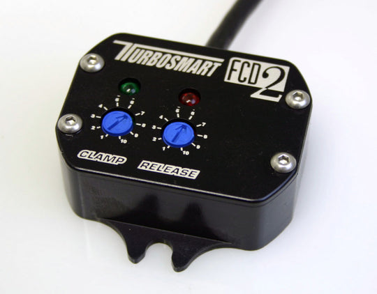 Turbosmart FCD-2 electronic boost controller accessory with digital display and control buttons for turbocharged vehicles.