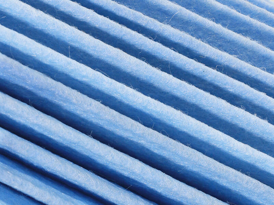 aFe Magnum FORCE Drop-In Air Filter with Dura-Dry media, 5.5-inch diameter, rectangular design, for vehicle intake systems.
