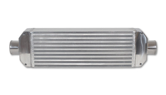 Vibrant air-to-air intercooler assembly with end tanks, measuring 18x6.5x3.25 inches, featuring inlet and outlet ports.