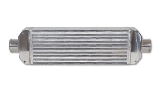 Vibrant air-to-air intercooler assembly with end tanks, measuring 18x6.5x3.25 inches, featuring inlet and outlet ports.